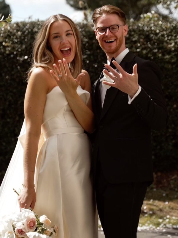Bride and groom showing their wedding rings – wedding film edited by WeddWonders