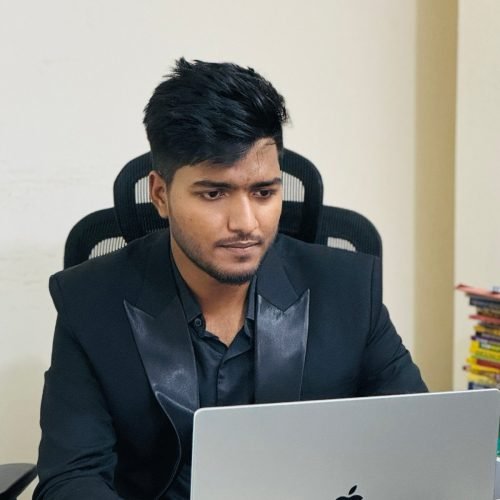 Saidur Rahaman Jahir, CEO of WeddWonders, editing a wedding film on his laptop